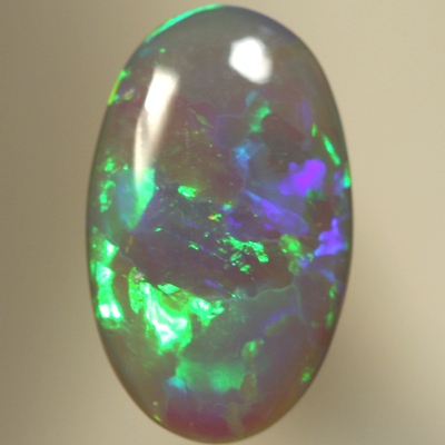 SOLID SEMI BLACK OPAL Very bright rolling flashes of neon green, orange, and purple. SEE VIDEO
